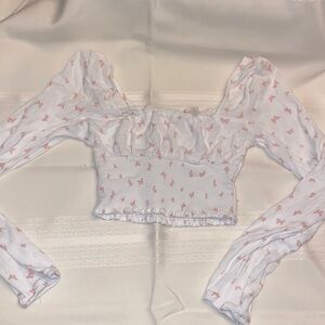 This is a white with pink butterfly top from pacsun! wore a couple of times